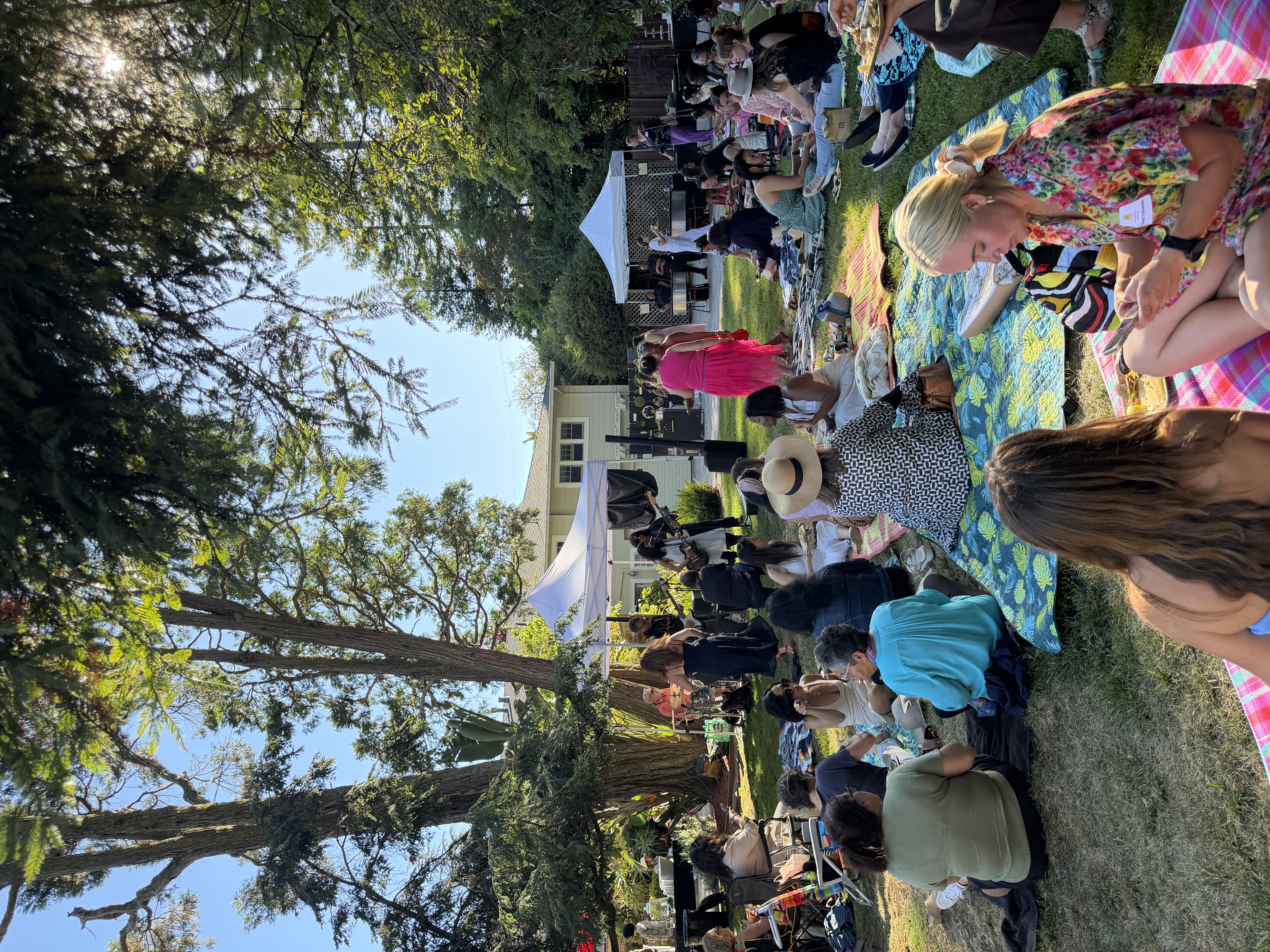 live music and a group of women in a yard or a garden